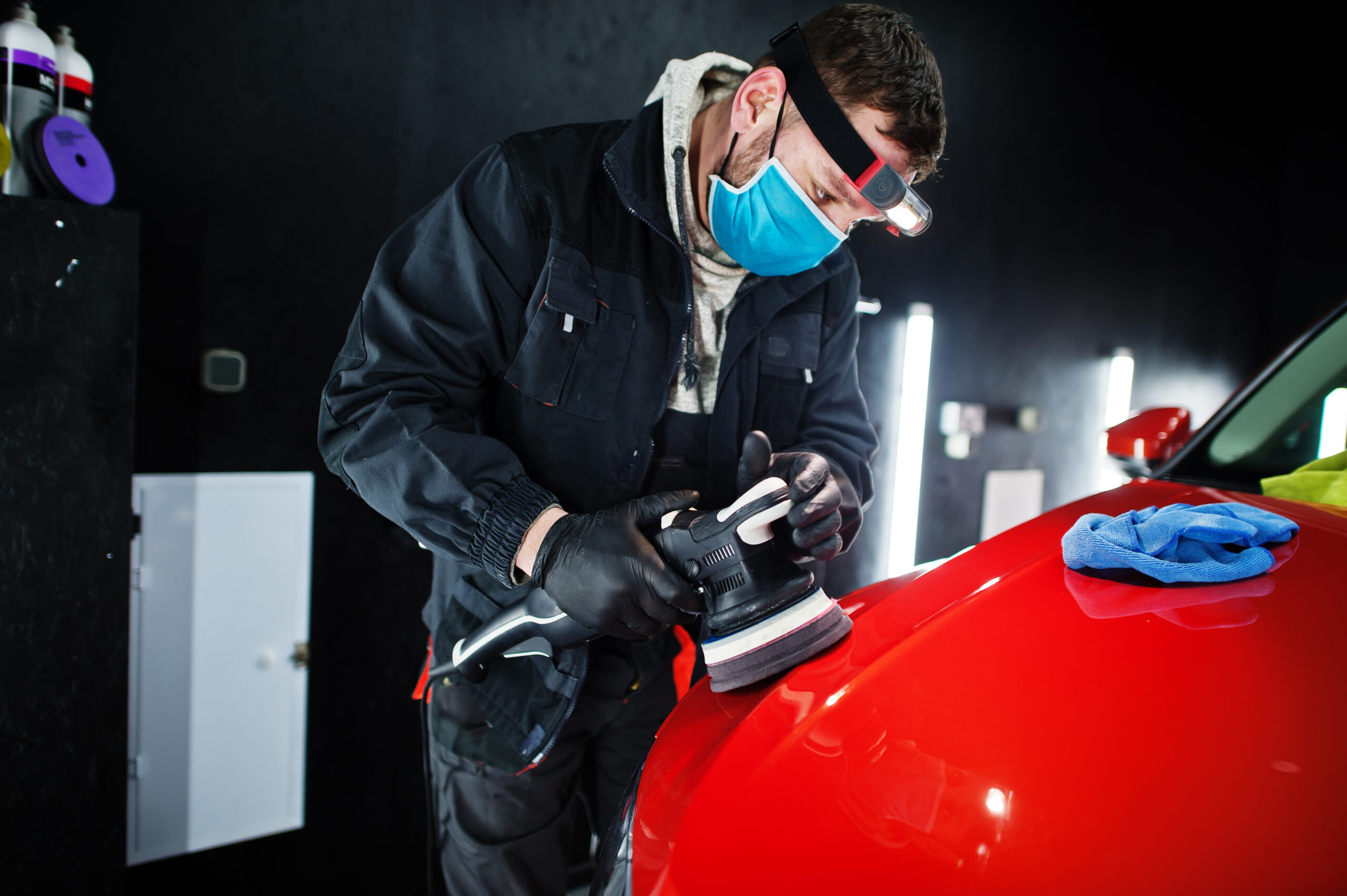 Professional car body polishing to remove dents and scratches